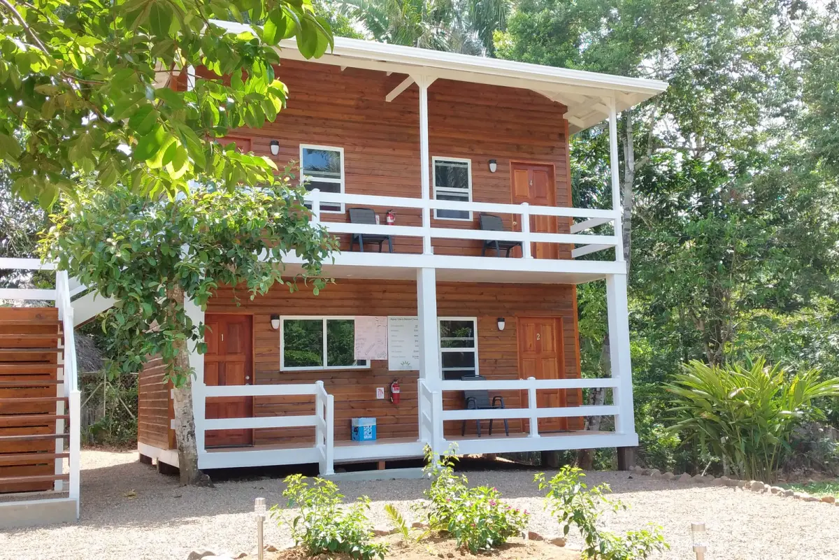 Two-story timber lodging building among the trees